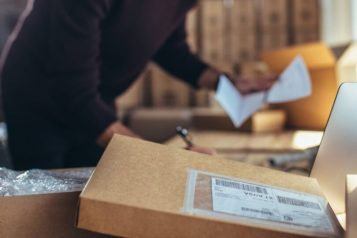 Person working in warehouse filled with boxes